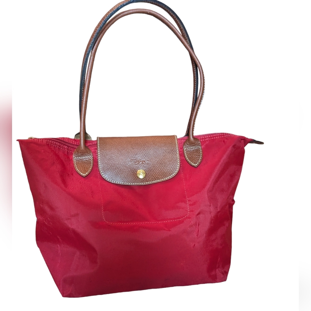 LONGCHAMP Le Pliage medium nylon tote in red.
